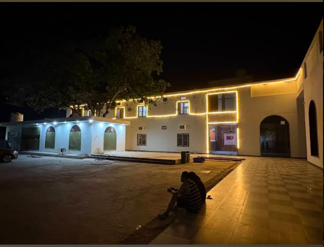 Maharaja Aggarsain Dharamshala illuminated at night in Julana, Haryana